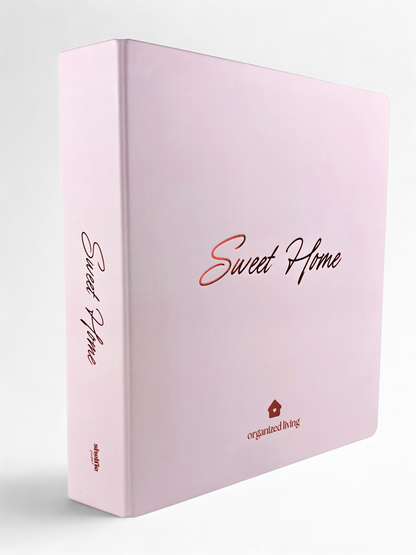 Pink notebook with 'Sweet Home' and 'organized living' text on a white background
